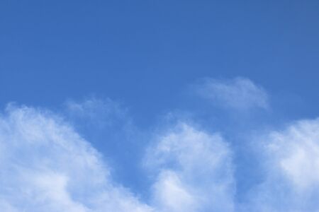 Blue sky and white clouds backgroundの写真素材