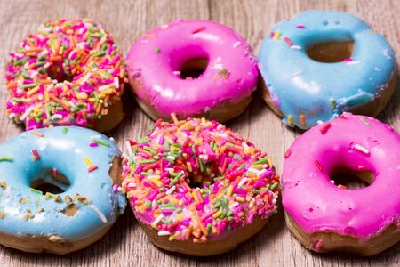 Donut Many colors are available on wooden floors.の写真素材