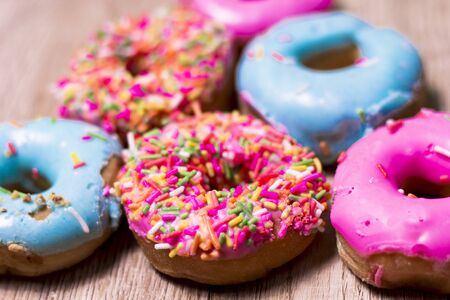 Donut 
Many colors are available on wooden floors.の写真素材