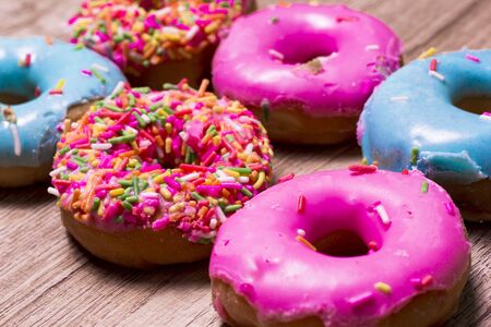 Donut 
Many colors are available on wooden floors.の写真素材
