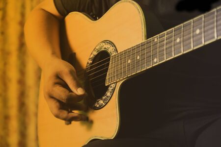 Men's black shirt, living acoustic guitar