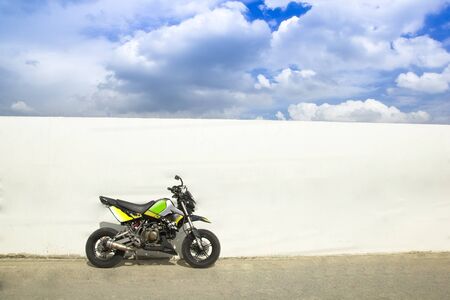 Motorcycle 
The view behind is the wall and the sky.の写真素材
