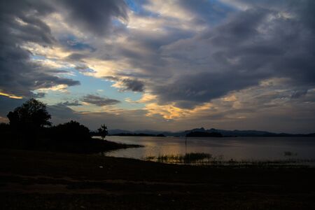 View of the evening sky, orange, blue and black combination is fascinating.の写真素材
