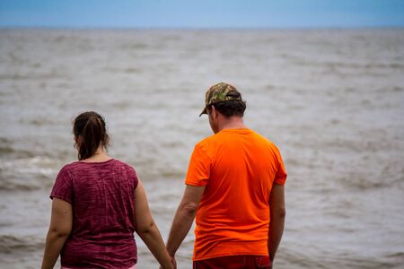 Lovers by the seaの写真素材