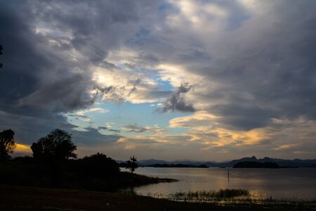 View of the evening sky, orange, blue and black combination is fascinating.の写真素材