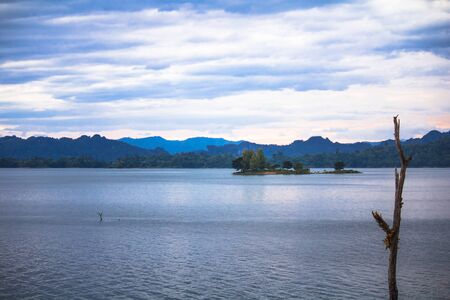 Mountain river with sky at dusk to dusk.の写真素材
