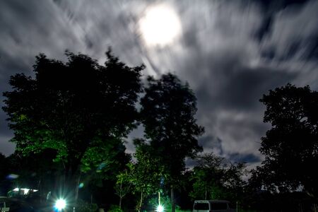 View the night sky from the hut and camping. Water intended to blur the imageの写真素材