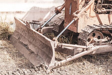 Old yellow-tone tracked tractors, heavy-dutyの写真素材