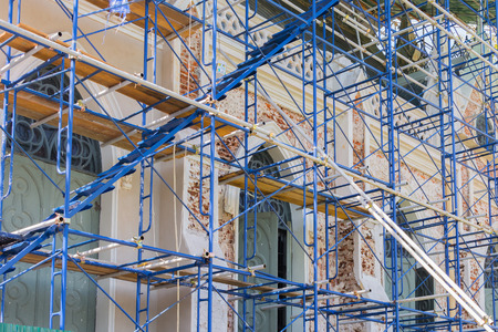Construction working on scaffolding