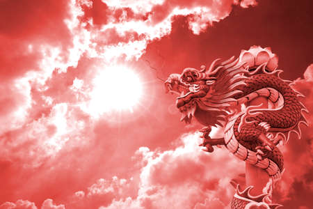 Red Dragon on red backgroundの写真素材