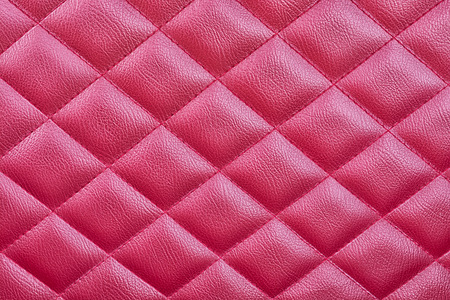 Red leather upholstery background for a luxury decorationの写真素材