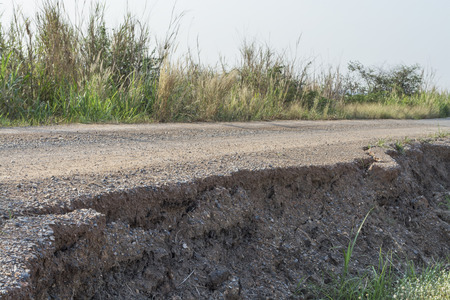 Asphalt surface on the street was demolished due to poor construction.の写真素材