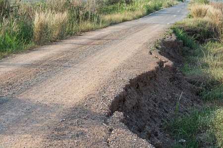 Asphalt surface on the street was demolished due to poor construction.の写真素材