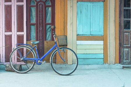 Bicycle on vintage wooden house wallの写真素材