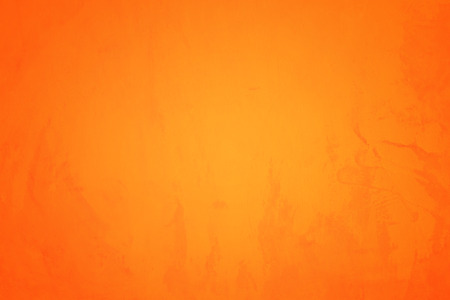 Orange abstract background texture. Blank for design, dark orange edgesの写真素材