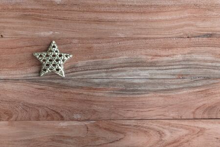 Gold star on wood top viewの写真素材
