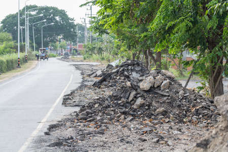 Asphalt surface on the street was demolished due to poor construction.の写真素材