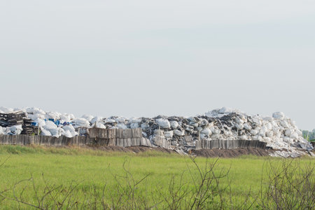 Garbage piles outdoors on a recycle site.