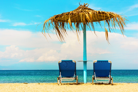 Two sunbeds at the beach の写真素材