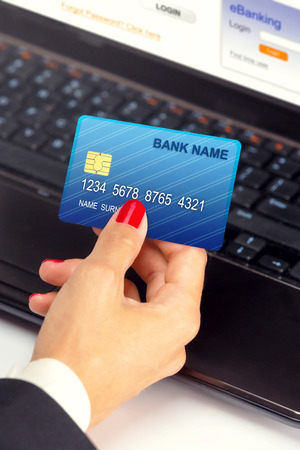 Businesswoman holding credit card - e banking   shopping online の写真素材