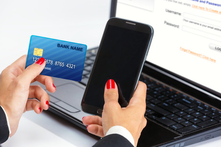 Female hand,using internet card for e-banking の写真素材