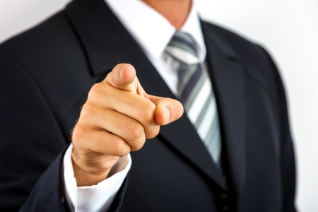 Close up of a young businessman, pointing with his finger の写真素材