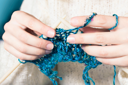 Close-up of hands knitting の写真素材