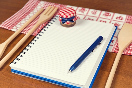 Recipe book on kitchen table の写真素材