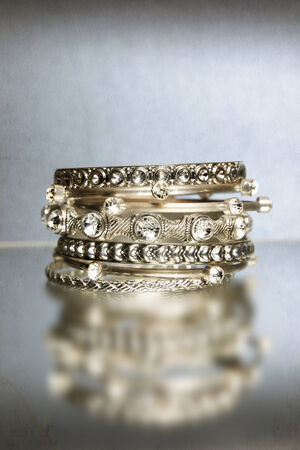 Several shining bracelets on blue .の写真素材