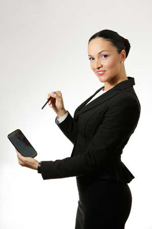 Young business woman holding smart phone.の写真素材