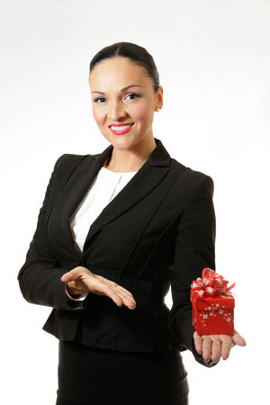 Business dressed woman with present.の写真素材