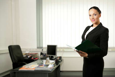 Young business woman inside office space,smiling.の写真素材