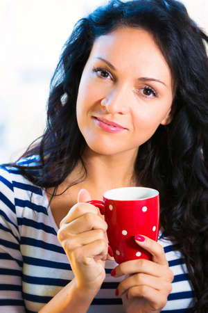 Young woman drinking tea.の写真素材