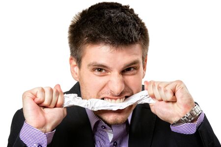 Frustrated young business man,isolated on white background.の写真素材