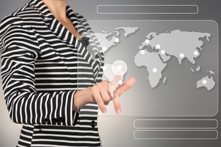 World wide connection concept. Young business woman touching screen.の写真素材
