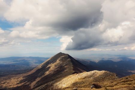Mountain landscape against cloudy sky.の写真素材
