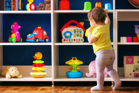 Toddler playing with her toys.の写真素材