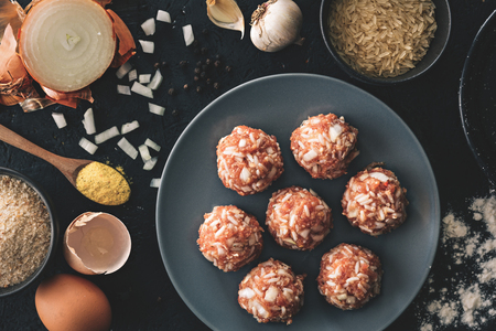 Traditional lunch recipe. Pork meatballs on top of the dark background. Food preparation. Top view.の写真素材