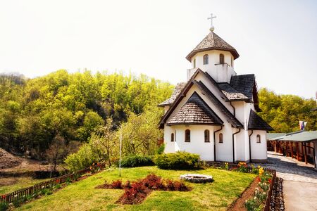 Christian orthodox church, surrounded with colorful forest.の写真素材