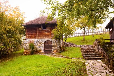 Old, traditional wood and stone peasant house.の写真素材