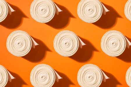 Top view of elastic bandage pattern, isolated against colorful background.