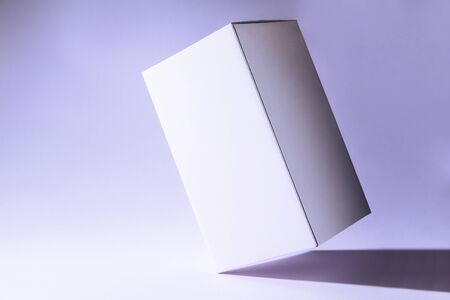 White box packaging template, isolated on purple background.の写真素材