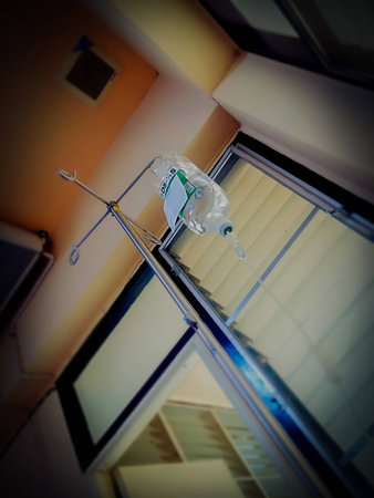 Selective focus Infusion bottle with solution in the patient roomの写真素材