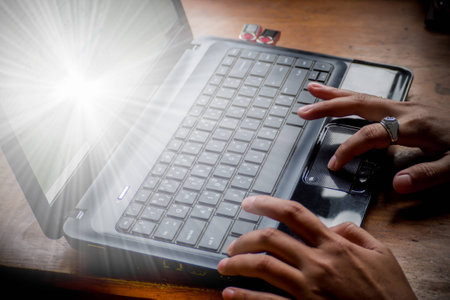 close up business man hand typing on laptop computer keyboard.の写真素材