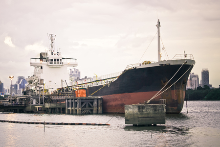 the cargo ship mooring at the harbourの写真素材