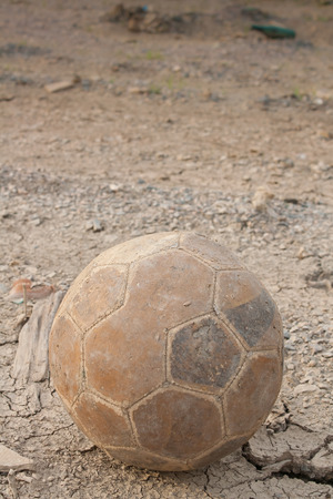 The old football on the grunge floorの写真素材