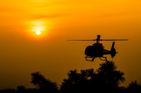 The patrol helicopter flying in the skyの写真素材
