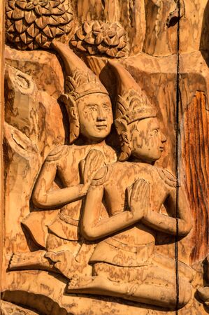 Murals, wood carvings, a Buddhist temple in Thailand.の写真素材