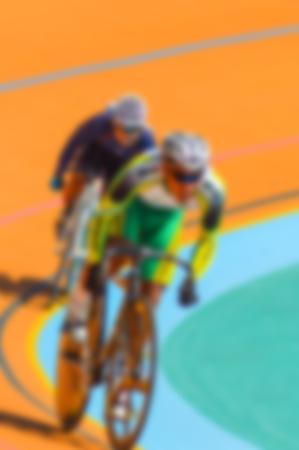 Bike race on velodrome track blurry for backgroundの写真素材