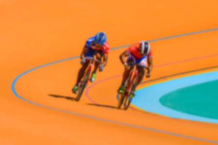 Bike race on velodrome track blurry for backgroundの写真素材